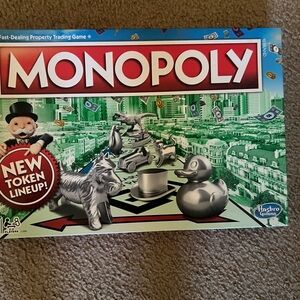 Hasbro Monopoly Board Game with Silver and Green Accents